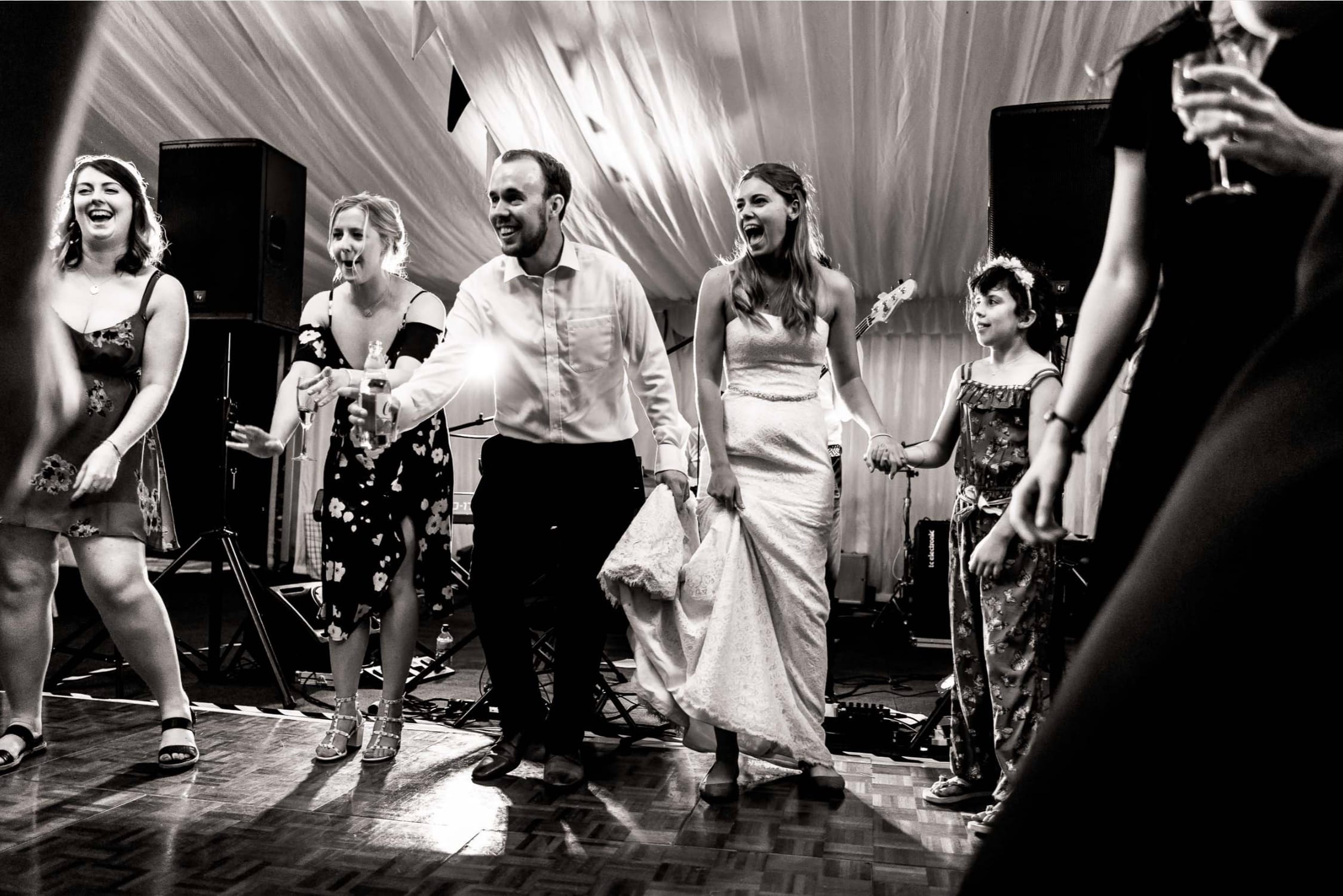 Natural pictures of couple and guests dancing and celebrating a wedding